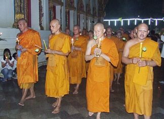 Monks lead the Wien Thien ceremony around Wat Chaimongkol last Tuesday for Visakha Bucha Day. Visakha Bucha Day is one of the three holiest days on the Buddhist calendar and this year was designated by UNESCO as “World Peace Day.”